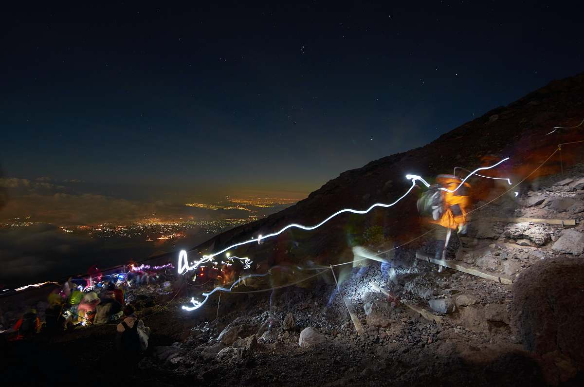 rock assorted-color lights on mountain at nightime night